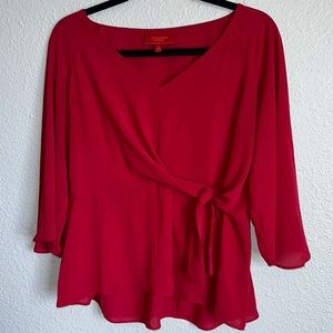 Jennifer Lopez peplum tie blouse.